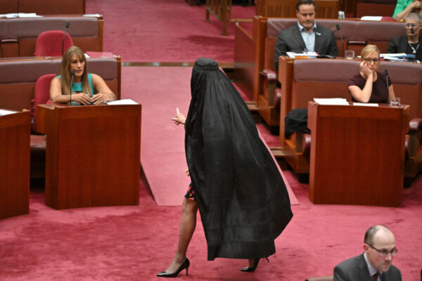 Far-right Australian senator suspended after entering Parliament in a burqa during protest