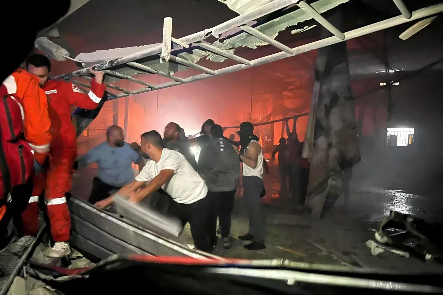 Lebanon reports 13 people killed in strike on Palestinian camp; Israel says it hit Hamas facility